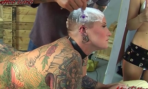 BlackwidowXXX acquiring a far-out head tattoo